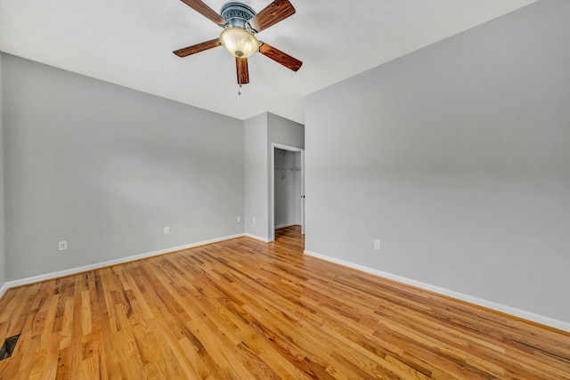 spare room featuring light wood-type flooring and ceiling fan