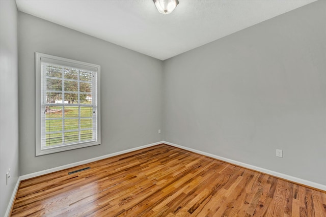 empty room with light hardwood / wood-style floors