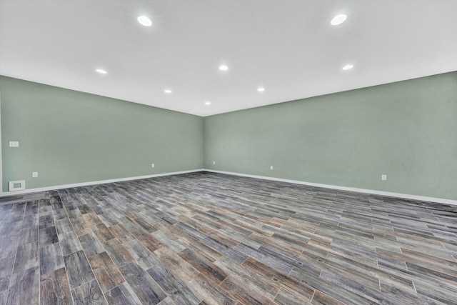 spare room with dark wood-type flooring