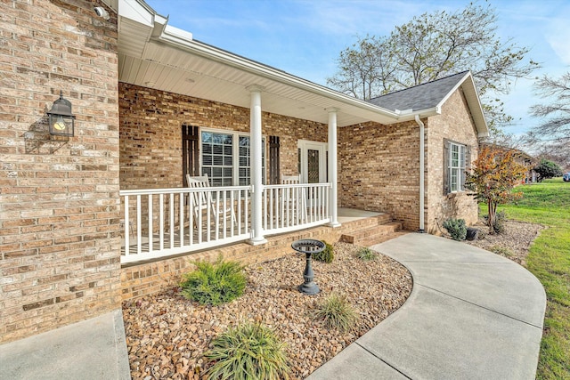 entrance to property featuring covered porch