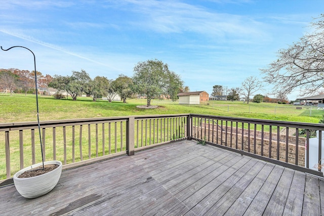 wooden deck featuring a yard