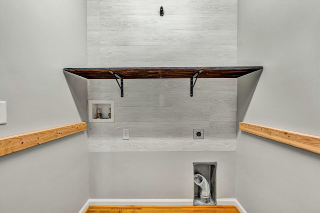 laundry area with washer hookup, electric dryer hookup, and hardwood / wood-style floors