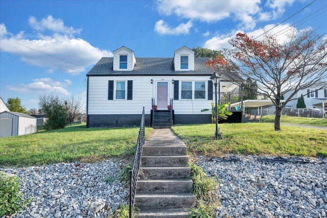 cape cod-style house with a front lawn