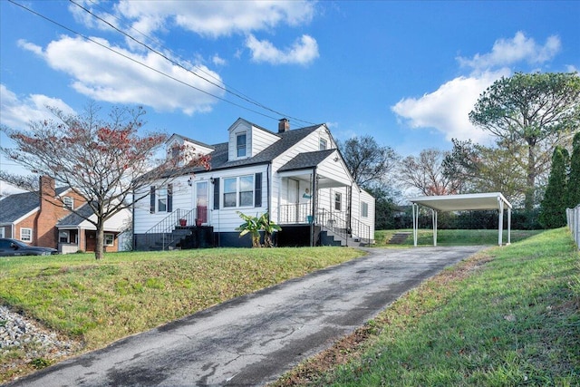 view of front facade with a front yard and a carport