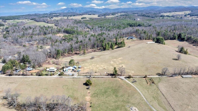 drone / aerial view featuring a mountain view and a rural view