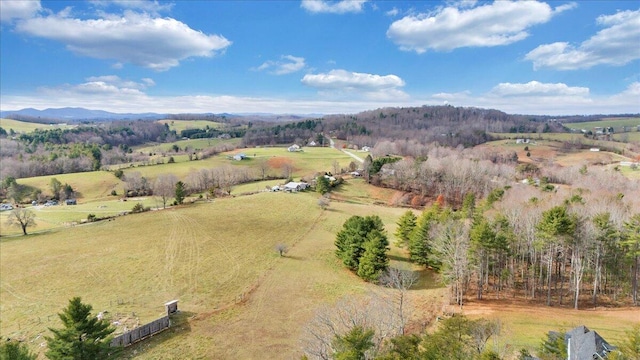 birds eye view of property featuring a rural view