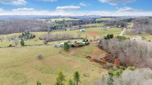 aerial view with a mountain view and a rural view