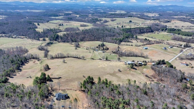 drone / aerial view featuring a rural view and a mountain view