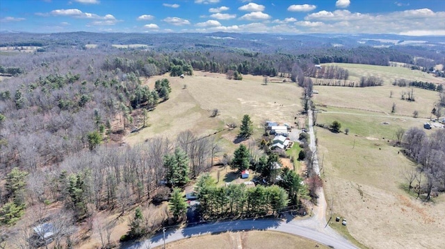 aerial view with a rural view and a view of trees