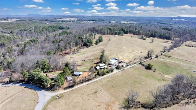birds eye view of property with a rural view and a forest view