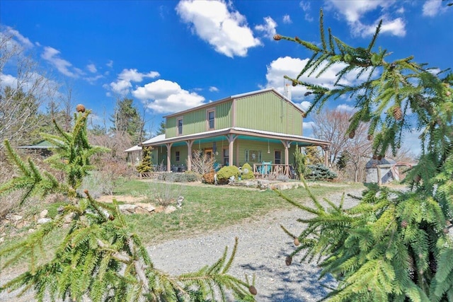 back of property featuring a porch