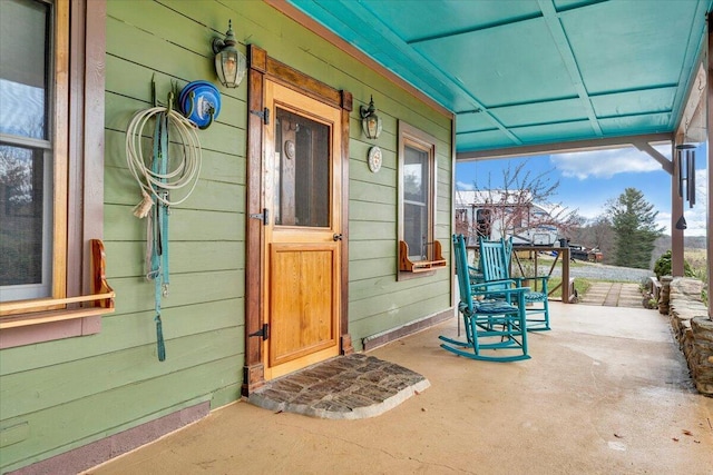 doorway to property with covered porch