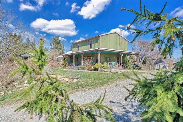 rear view of house with covered porch