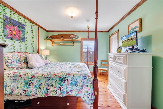 bedroom featuring crown molding and light hardwood / wood-style flooring