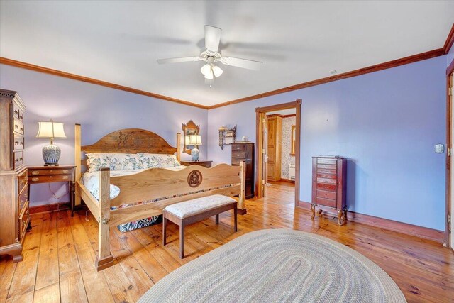bedroom with wood-type flooring, baseboards, crown molding, and a ceiling fan