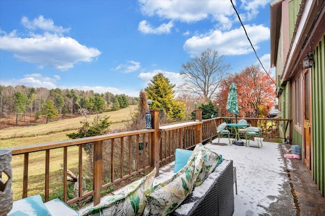 wooden balcony featuring outdoor lounge area and a deck