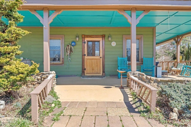 property entrance with covered porch
