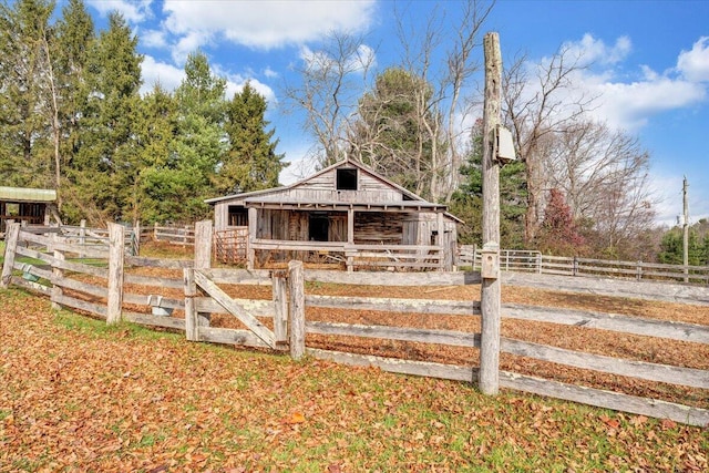 exterior space with an outbuilding and a rural view