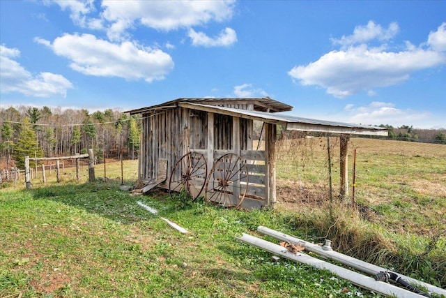 view of outbuilding with a rural view