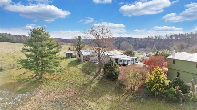 birds eye view of property with a rural view