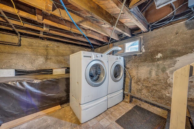 clothes washing area featuring independent washer and dryer