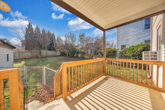 wooden terrace with a lawn