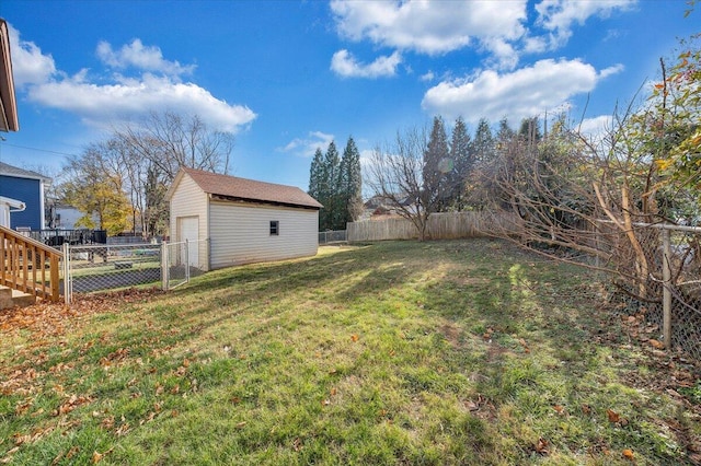 view of yard featuring an outbuilding and a garage