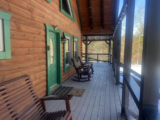 wooden terrace with a porch