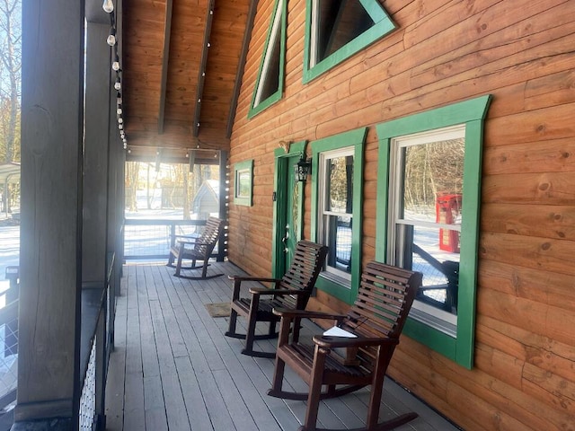 wooden terrace with a porch