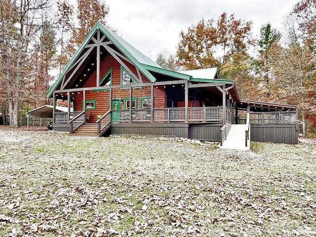 log home featuring a carport