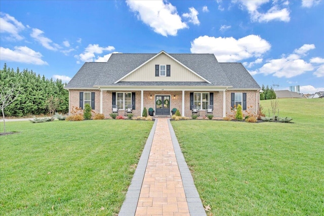 view of front of property with a porch and a front yard