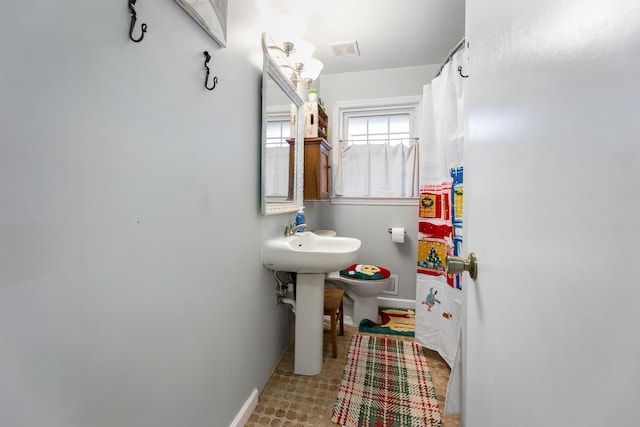 bathroom with sink and toilet