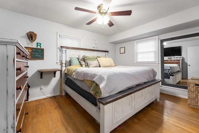 bedroom with wood-type flooring and ceiling fan