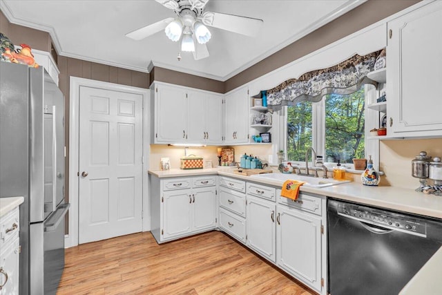 kitchen with dishwasher, white cabinetry, crown molding, and stainless steel refrigerator