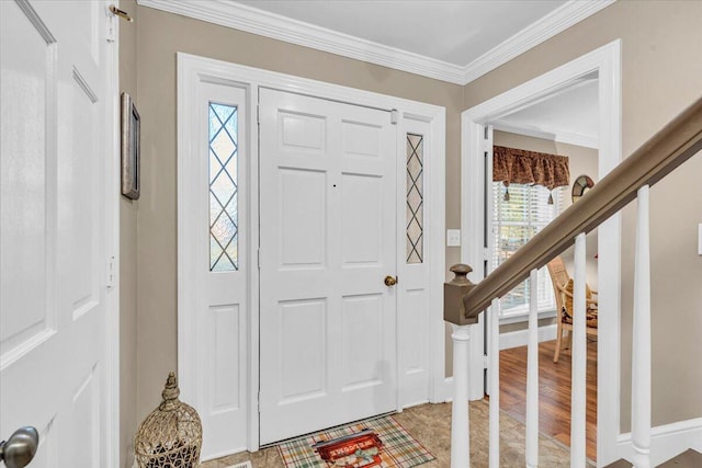 entryway with hardwood / wood-style floors and crown molding