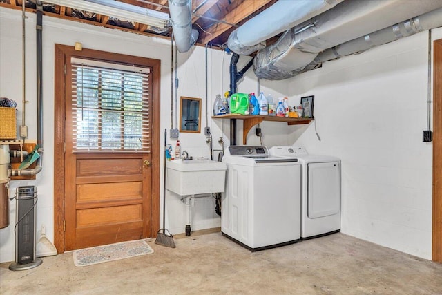 laundry room featuring washer and clothes dryer and sink