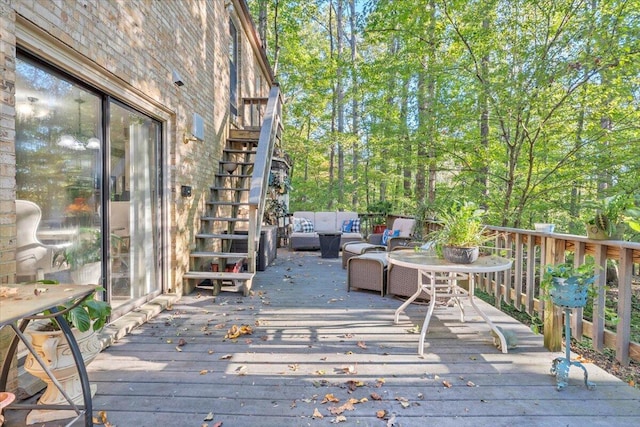 wooden terrace with outdoor lounge area