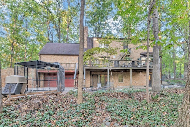 back of property with a wooden deck