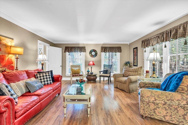 living room featuring hardwood / wood-style flooring and ornamental molding