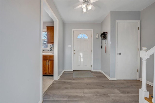 foyer featuring light hardwood / wood-style flooring and ceiling fan