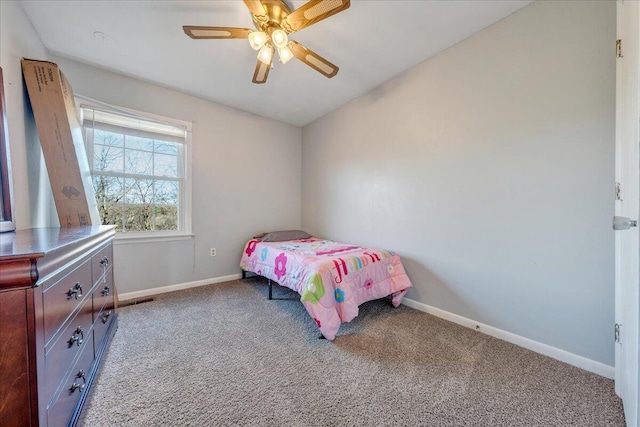 carpeted bedroom with vaulted ceiling and ceiling fan