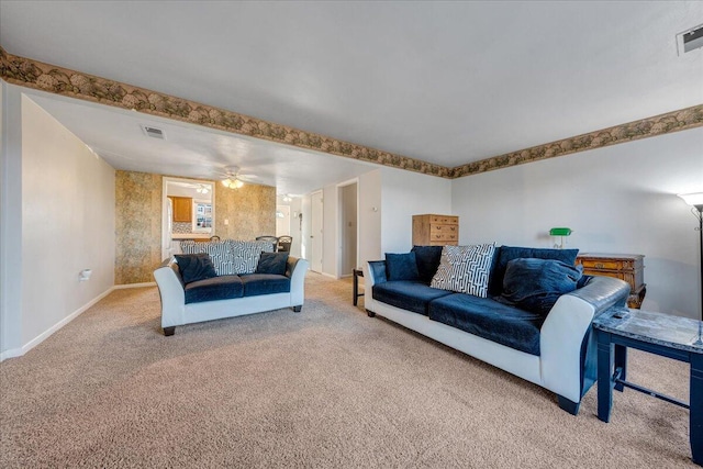 living room featuring ceiling fan and carpet floors