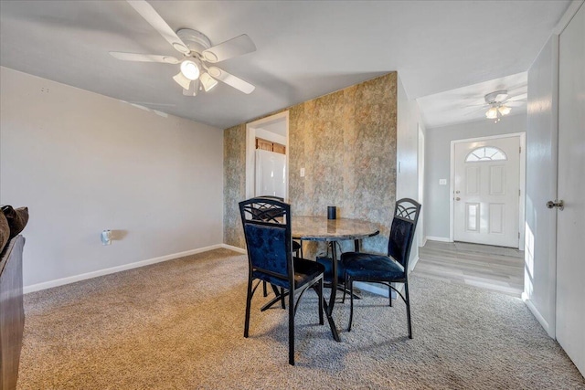 dining room with carpet flooring and ceiling fan