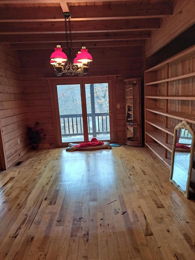 unfurnished sunroom with wooden ceiling and beam ceiling