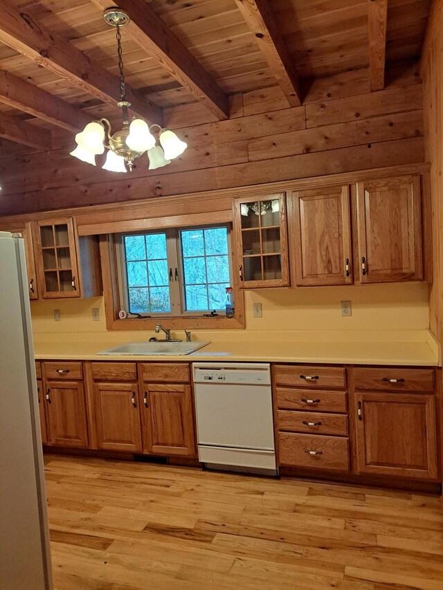 entryway with stairs, beamed ceiling, independent washer and dryer, and wooden walls