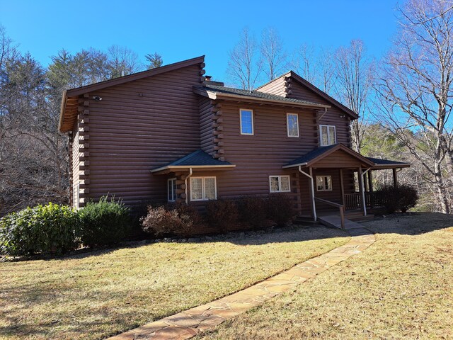 view of home's exterior featuring a lawn