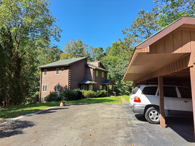 view of property exterior with a lawn