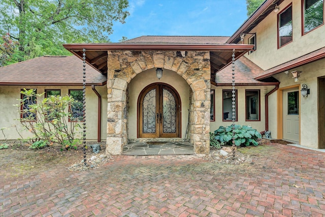 view of exterior entry featuring french doors