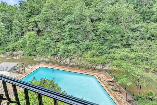 view of pool with a water view