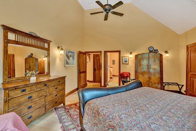 bedroom with ceiling fan and high vaulted ceiling